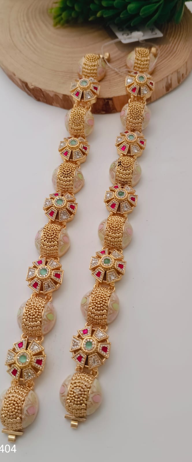 Desi Gold Floral Bracelet With Green And Pink Gemstone Accents