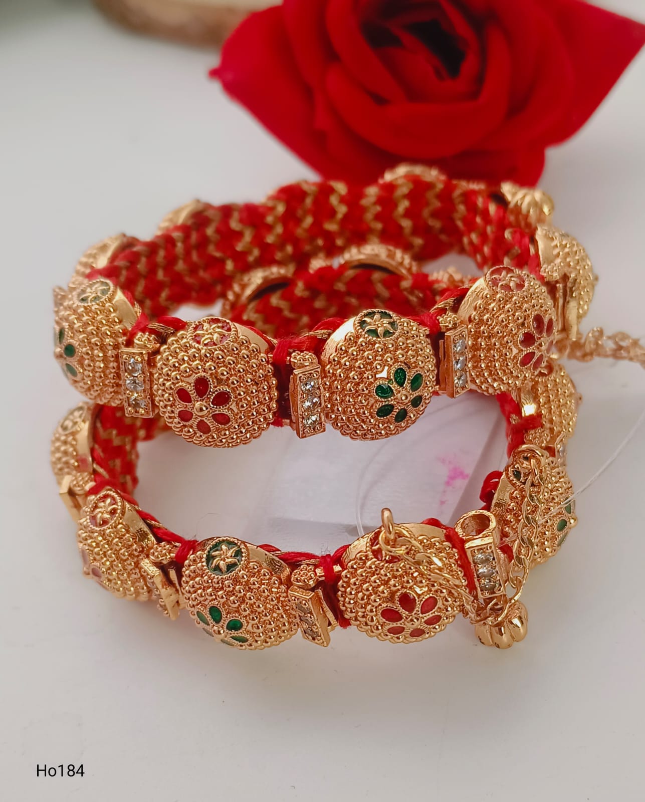 Desi Red Thread Bracelet With Golden Charms