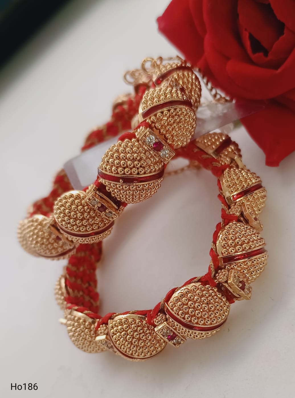 Golden Bracelet With Red Accents And Gems