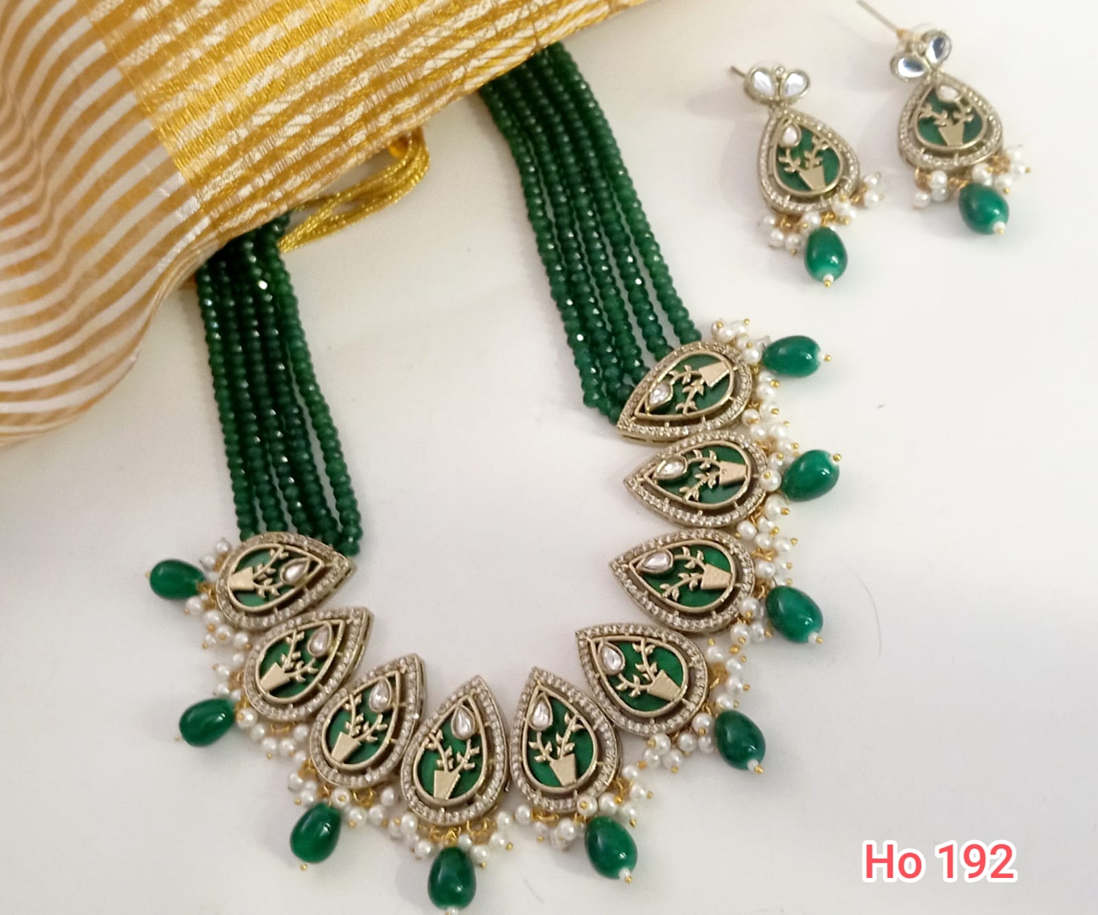 A Traditional Green Gemstone Necklace With Pear Shaped Pendants